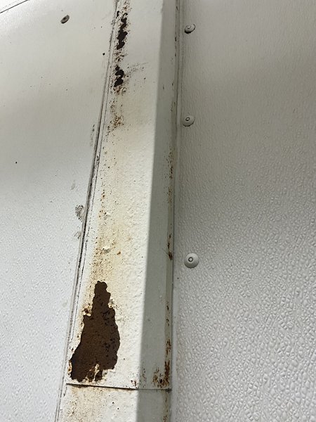 Paint flaking on frame pole.
