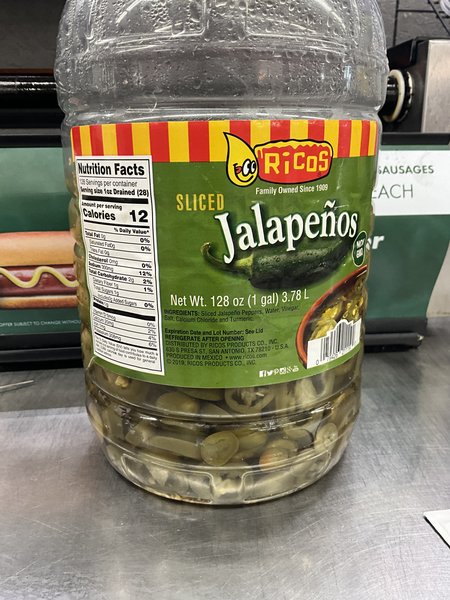 Jalapeños stored out of cold hold,  “refrigerate after opening”
